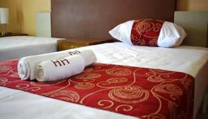 Postel nebo postele na pokoji v ubytování Hypertek Guesthouse