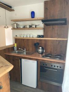 a kitchen with a sink and a stove at Perschlingtalhof in Auern