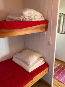 a couple of bunk beds in a room at Svens Stuga in Burträsk