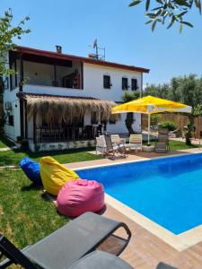 a villa with a swimming pool and a house at Antik House İznik in İznik