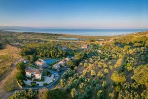 an aerial view of a home with the ocean in the background at Hang Loose Cottage in Gizzeria
