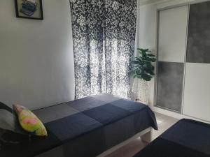 Posteľ alebo postele v izbe v ubytovaní NOOL Sevilla