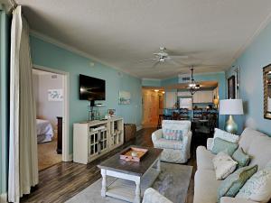 a living room with a couch and a table at Palacio #1003 in Perdido Key