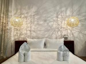 Letto o letti in una camera di Nacpan Beach Resort Managed by H Hospitality Group