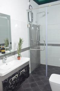 Koupelna v ubytování Vidushi Home