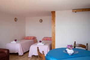 Postel nebo postele na pokoji v ubytování Hotel Vittoria