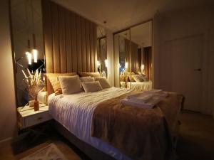 Posteľ alebo postele v izbe v ubytovaní Gold Apartment B29 Let's Sea Baltic Park Gąski