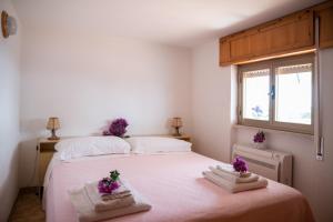 Postel nebo postele na pokoji v ubytování Hotel Vittoria