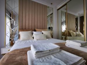 Posteľ alebo postele v izbe v ubytovaní Gold Apartment B29 Let's Sea Baltic Park Gąski