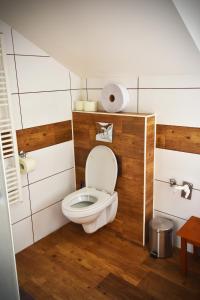 a bathroom with a toilet in a room at Apartmán Restaurace 16 