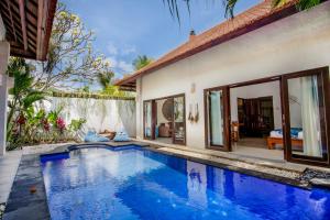 an image of a swimming pool in a villa at Villa Joyosa in Seminyak