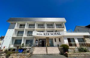 a white building with a sign that reads hotel ker naval at Hôtel Ker-Noyal Quiberon Plage in Quiberon