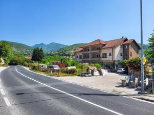 an empty street with a house on the side of the road at Nera-etwa Konjic 2 room in Konjic