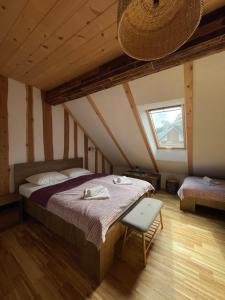 a bedroom with a large bed in a attic at Turistična kmetija Grabnar in Bled