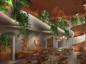 een restaurant met tafels en planten aan de plafonds bij FRESKIA GOLEM in Golem
