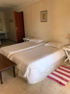 Postel nebo postele na pokoji v ubytování Riverfront Homestay