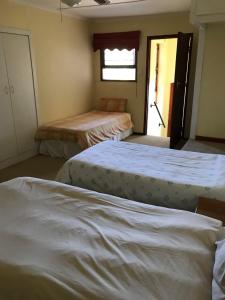 Postel nebo postele na pokoji v ubytování Riverfront Homestay