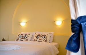 Posteľ alebo postele v izbe v ubytovaní Olive Coast Suites