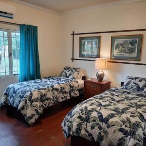 A bed or beds in a room at Lagoona Villa