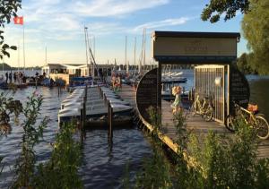 a marina with a dock with boats in the water at Bett 4 you Hamburg-Alster in Hamburg