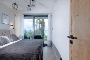 Posteľ alebo postele v izbe v ubytovaní Resort HEVENIA Rewal 3