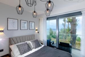 Posteľ alebo postele v izbe v ubytovaní Resort HEVENIA Rewal 3