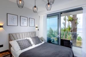 Posteľ alebo postele v izbe v ubytovaní Resort HEVENIA Rewal 3 + 37 fotografií
