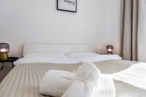 Łóżko lub łóżka w pokoju w obiekcie A&S Center Apartment Vienna