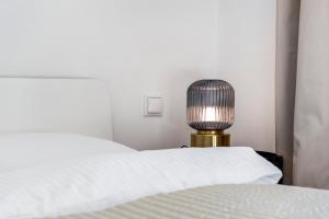 Łóżko lub łóżka w pokoju w obiekcie A&S Center Apartment Vienna