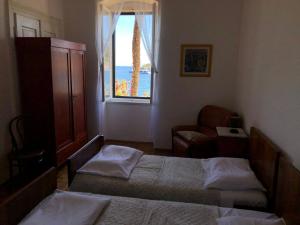 Posteľ alebo postele v izbe v ubytovaní Apartment Marasovic
