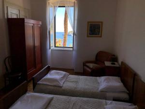 Postel nebo postele na pokoji v ubytování Apartment Marasovic