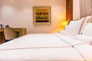 Katil atau katil-katil dalam bilik di Isglo Hotels Ikoyi