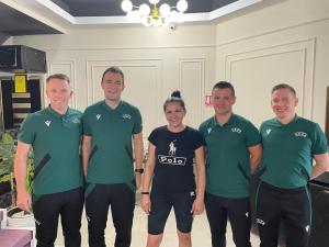 a group of people in green shirts posing for a picture at Hotel Villa Ovidiu in Drobeta-Turnu Severin