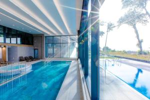 Bazén v ubytovaní Resort HEVENIA Rewal 3 alebo v jeho blízkosti