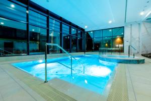 Bazén v ubytovaní Resort HEVENIA Rewal 3 alebo v jeho blízkosti