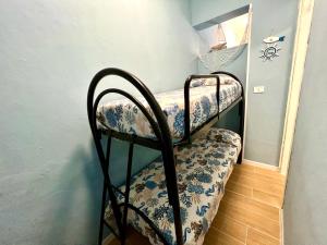 Postel nebo postele na pokoji v ubytování Casa del Pescatore