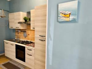 Kuchyň nebo kuchyňský kout v ubytování Casa del Pescatore