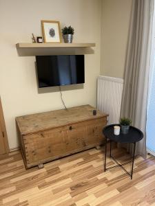 a living room with a flat screen tv on the wall at Apartma Slivnik in Spodnje Gorje