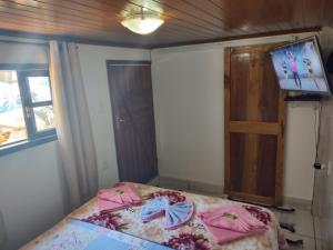 Posteľ alebo postele v izbe v ubytovaní Hospedagem capitão Hula