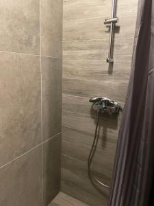 a shower with a faucet in a bathroom at Chalet FiMiLi in Vyšná Boca +30 photos