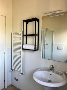 a bathroom with a sink and a mirror at Luxardotel in Rome