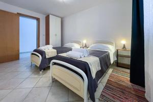 Voodi või voodid majutusasutuse Relax e spazio a due passi dal mare toas