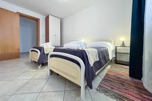Voodi või voodid majutusasutuse Relax e spazio a due passi dal mare toas