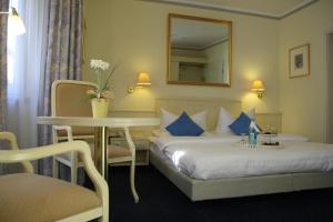 Ein Bett oder Betten in einem Zimmer der Unterkunft Hotel Dalberg