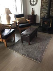 a living room with furniture and a fire place at Breckenridge Chalet near Yosemite. Dog friendly! in Groveland