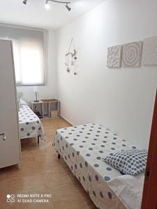 Ένα ή περισσότερα κρεβάτια σε δωμάτιο στο Apartamento Deltebre