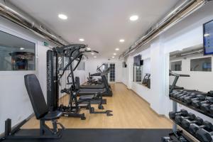 a row of tread machines in a fitness room at Oceanis Park Hotel in Ixia