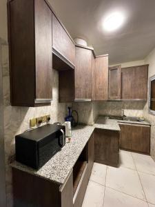 Kuchyň nebo kuchyňský kout v ubytování RESIDENCE NOUMSI