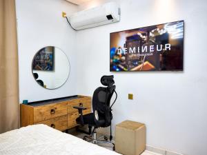 TV a/nebo společenská místnost v ubytování RESIDENCE NOUMSI