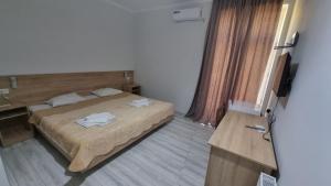 Voodi või voodid majutusasutuse Hotel Giorgi toas